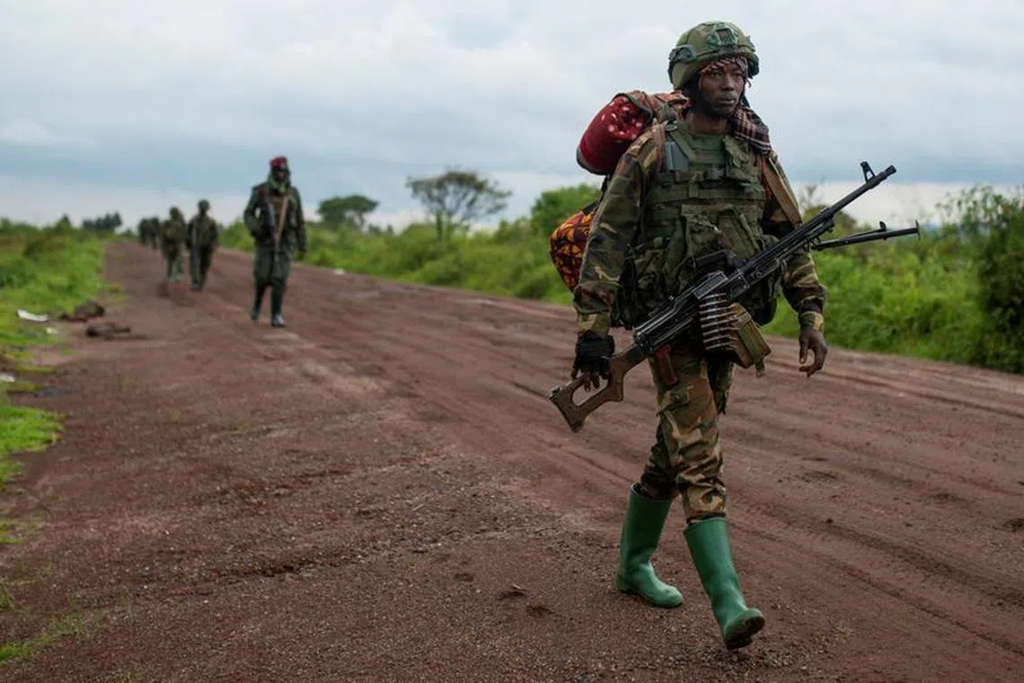FILE PHOTO: Congolese M23 rebels are seen as they withdraw from the 3 antennes location in Kibumba, near Goma, North Kivu province of the Democratic Republic of Congo, December 23, 2022. REUTERS/Arlette Bashizi/File Photo