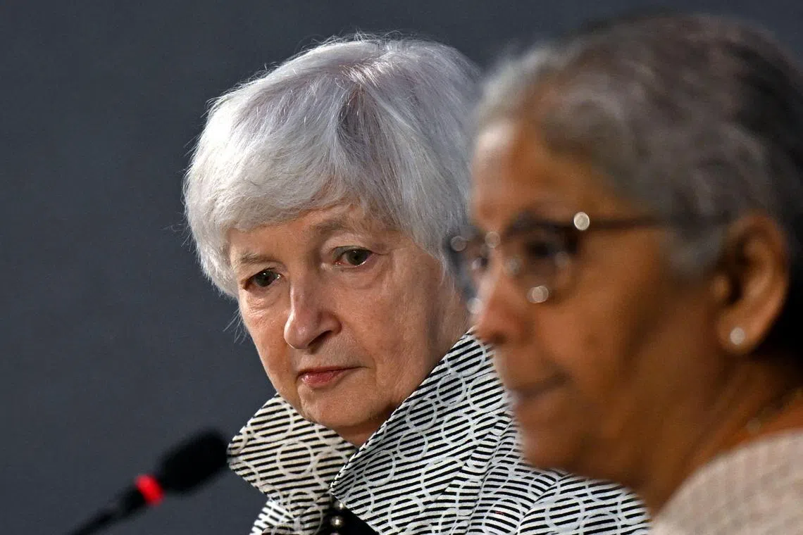 US Treasury Secretary Janet Yellen (L) listens to India's Finance Minister Nirmala Sitharaman during a joint statement with US as part of the G20 Finance Ministers, Central Bank Governors (FMCBG) and Finance & Central Bank Deputies (FCBD) meetings, at the Mahatma Mandir in Gandhinagar on July 17, 2023. G20 finance and central bank chiefs opened talks on July 17 discussing debt restructuring deals, multilateral bank reform and finance to tackle climate change, aiming to bolster a sagging global economy. (Photo by Punit PARANJPE / AFP)