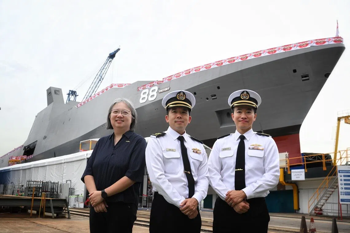 (From left) Defence Science and Technology Agency’s senior programme manager (combat systems tech development) Tan Hui Ling, Lieutenant-Colonel Karl Su and Lieutenant-Colonel Auyong Kok Phai with MRCV Victory on Oct 21.