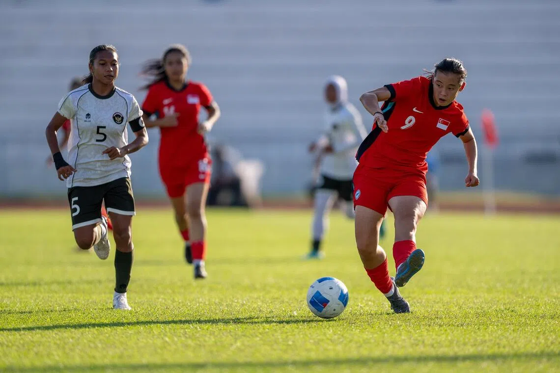 Danelle Tan plays a pass that leads to the Lionesses' goal in their match against Indonesia in their SEA Games women's football tournament opener on Dec 7. 
Credit: Singapore National Olympic Council