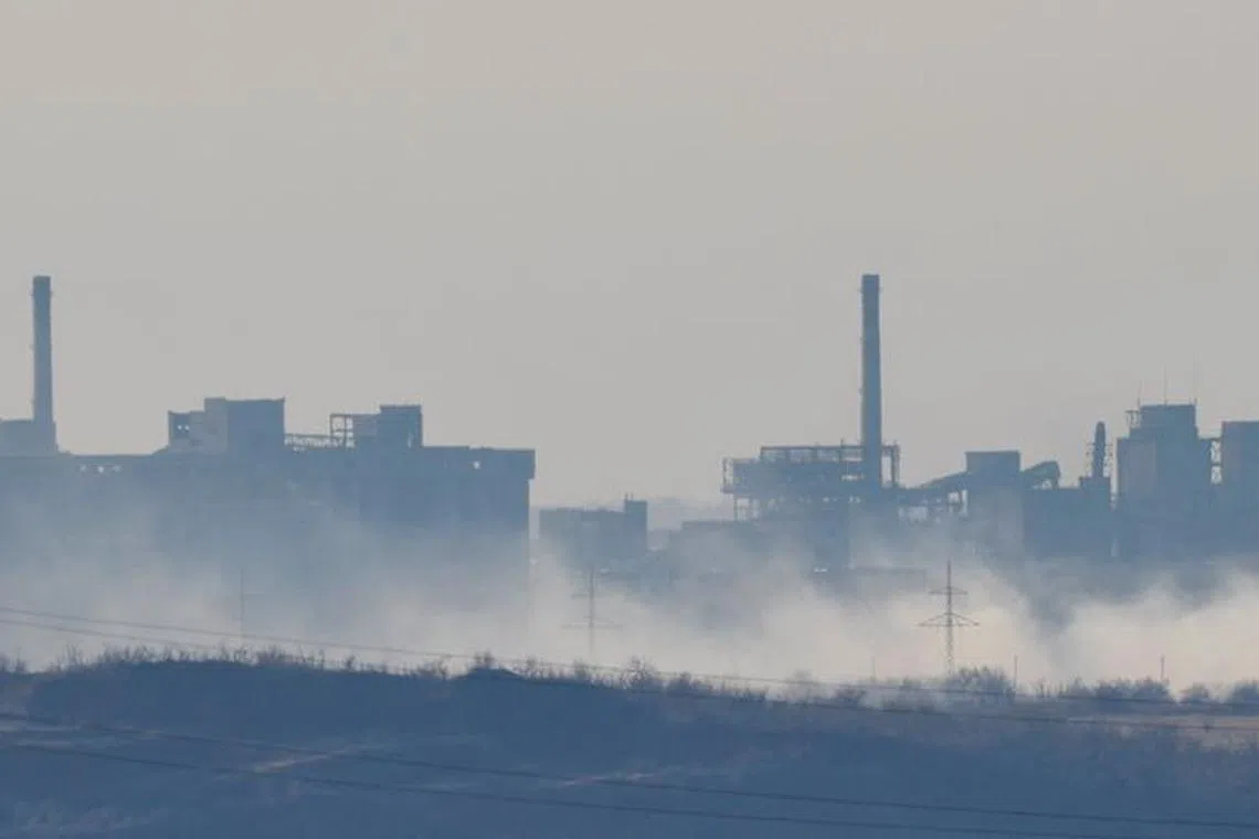 Smoke rises near the Avdiivka Coke and Chemical Plant in the town of Avdiivka in the course of Russia-Ukraine conflict, as seen from Yasynuvata (Yasinovataya) in the Donetsk region, Russian-controlled Ukraine, February 15, 2024. REUTERS/Alexander Ermochenko