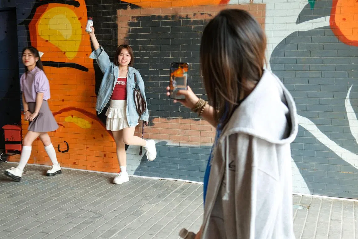awletter26 - The popularity of wang hong has affected how the Chinese has used social media, who will emulate influencers they follow online to take similar pictures at specific locations, such as 798 art district, a popular hang out spot in Beijing, said Professor Li Xinxiang at the Communication University of Zhejiang in south-eastern China. 

Copyright: Aw Cheng Wei
