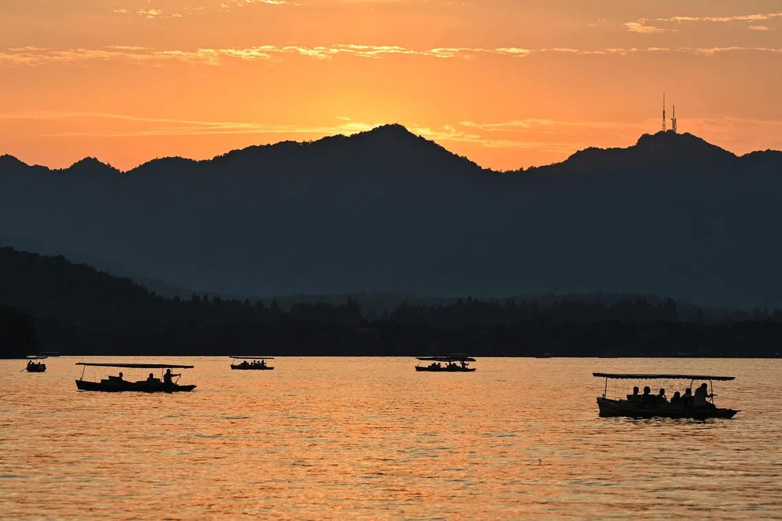 People riding boats on the West Lake in Hangzhou, China's eastern Zhejiang province on Sept 18, ahead of the 19th Asian Games to be held in the city from Sept 23 till Oct 8. 