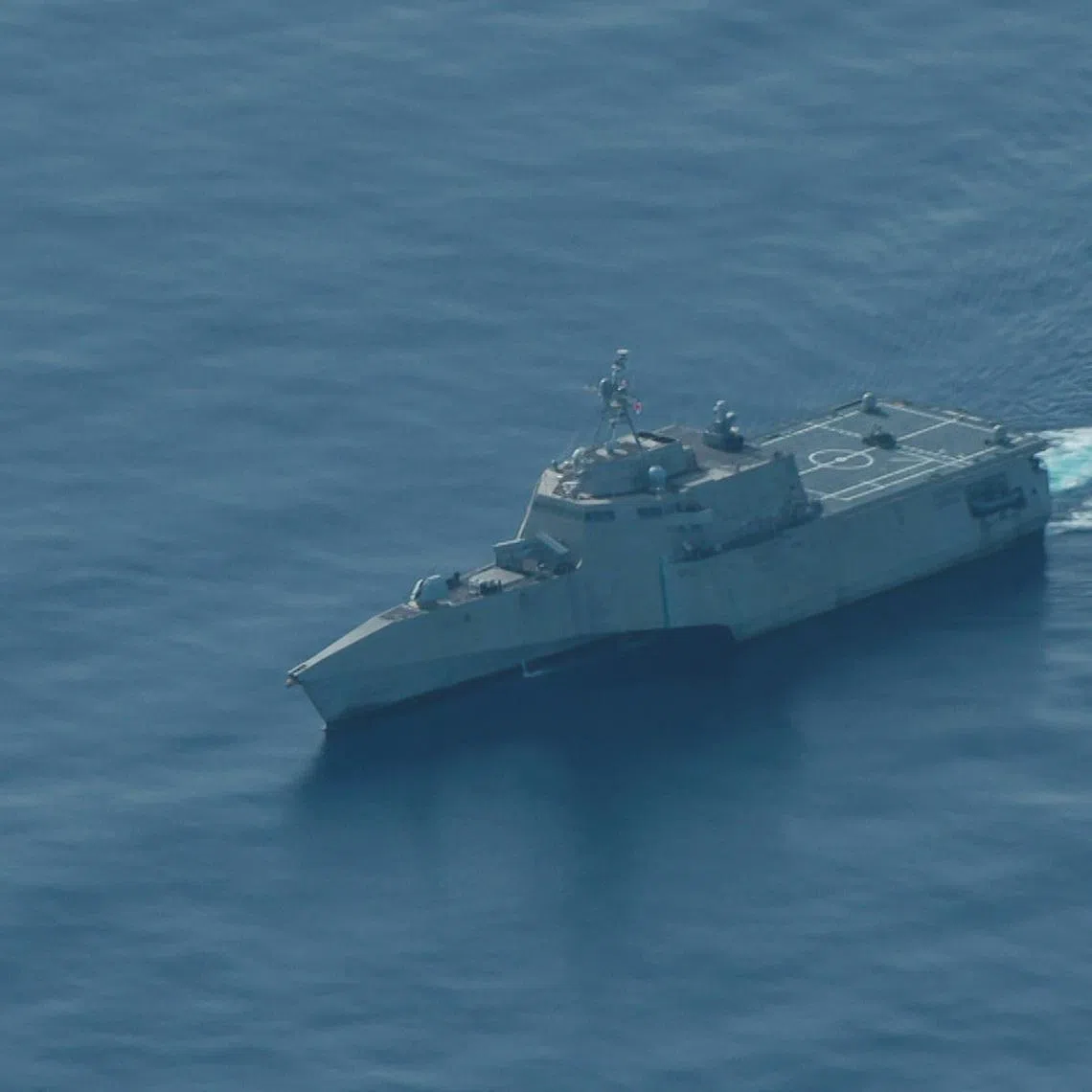 An aerial view of the USS Cincinnati combat ship navigating near the disputed Scarborough Shoal on Aug 13, 2025.