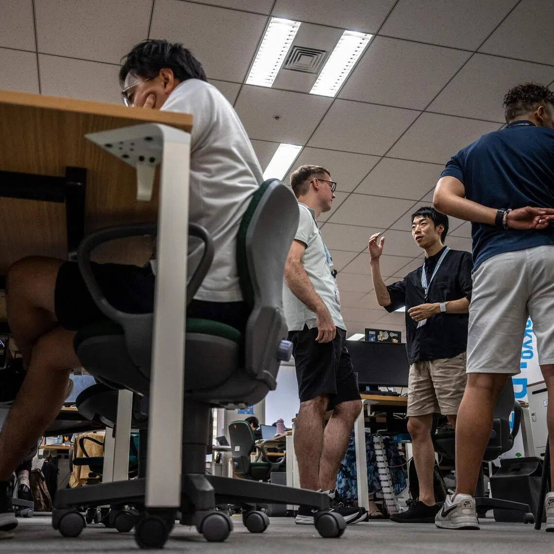 Government officials in casual dress code, including shorts, tee shirts and sneakers as part of the Tokyo’s “Cool Biz” initiative.