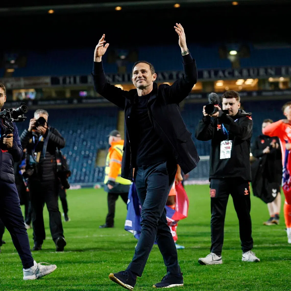 Coventry City manager Frank Lampard celebrates after winning promotion to the Premier League.