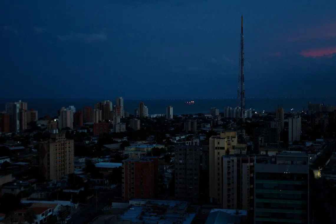 FILE PHOTO: A view of the buildings in the dark during a power outage, although power is returning in some parts of the city and the country, after a nationwide blackout, in Maracaibo, Venezuela August 30, 2024. REUTERS/Isaac Urrutia/File Photo