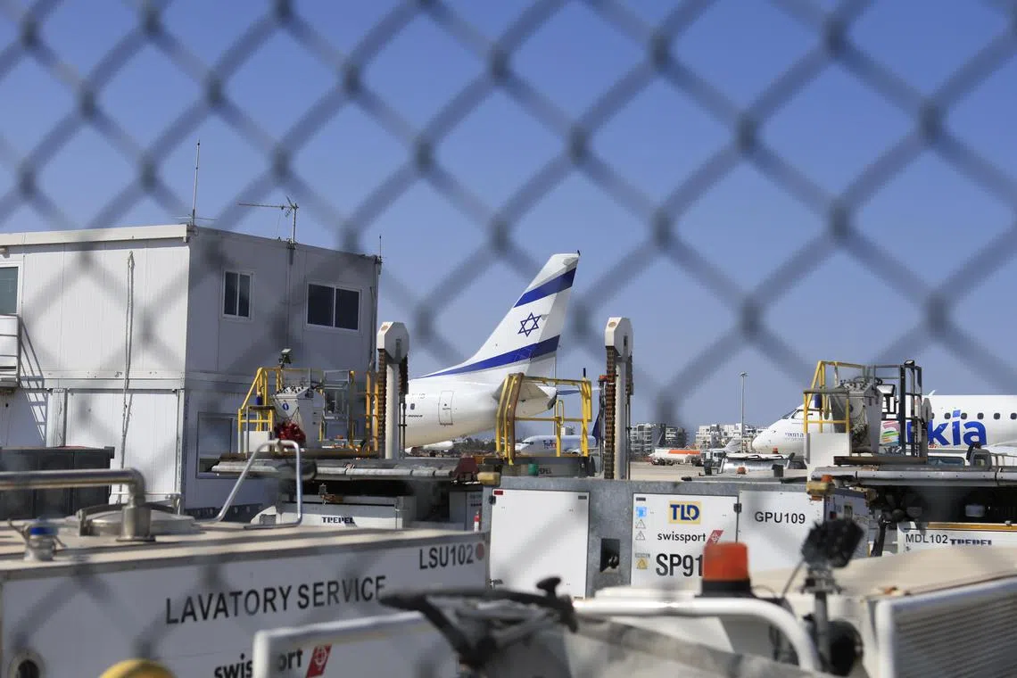 An israeli El Al commercial jet evacuated during the ongoing war between Israel and Iran, is parked on the tarmac at Larnaca International airport in Cyprus, on June 19.