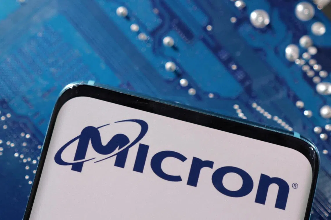A smartphone with a displayed Micron logo is placed on a computer motherboard in this illustration taken March 6, 2023. REUTERS/Dado Ruvic/Illustration/File Photo