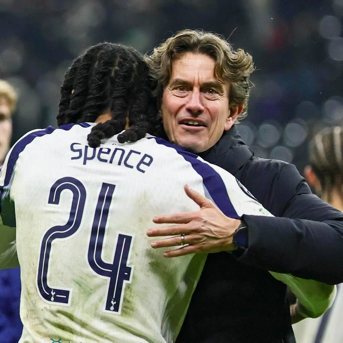 Tottenham manager Thomas Frank and Djed Spence hug after winning the Champions League match against Eintracht Frankfurt.