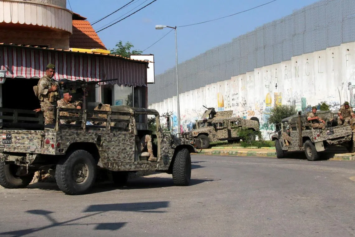 Lebanese army members are stationed in Kfar Kila, near the border with Israel, in southern Lebanon on Friday.  