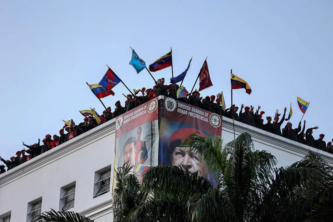 Members of the guard of honour of Venezuelan President Nicolas Maduro standing on the roof of the Miraflores presidential palace during a swearing-in march for combatant forces in Caracas on Jan 7, 2025. On Jan 10, Venezuela's President Nicolas Maduro is to be sworn in for a third six-year term.