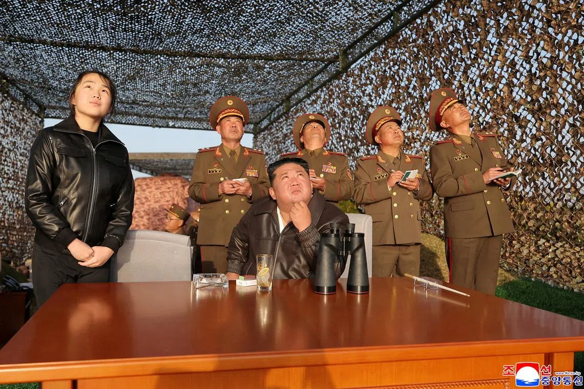 North Korean leader Kim Jong Un, accompanied by his daughter Ju Ae, oversees test launches on April 19.
