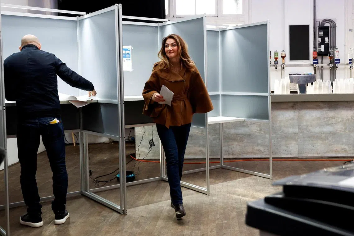Dutch VVD party leader Dilan Yesilgoz casts her ballot in Amsterdam.