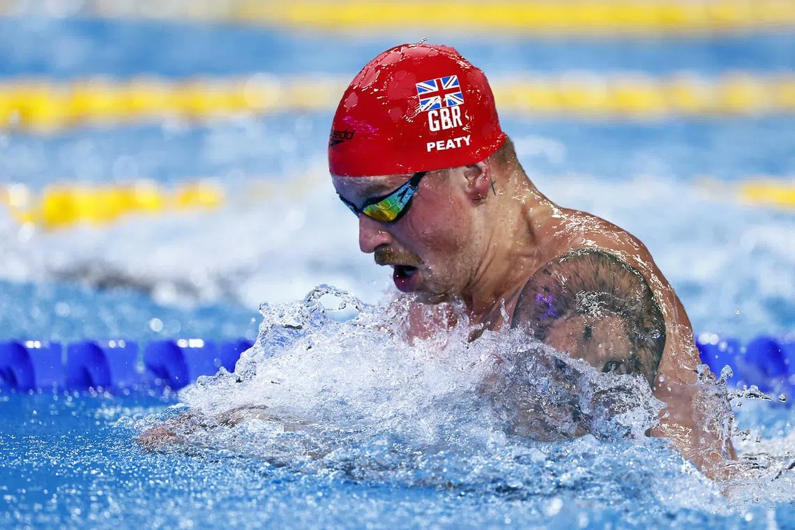 FILE PHOTO: Swimming - World Aquatics Championships - Aspire Dome, Doha, Qatar - February 13, 2024 Britain's Adam Peaty in action during the men's 50m breaststroke semifinal 1 REUTERS/Clodagh Kilcoyne/FILE PHOTO