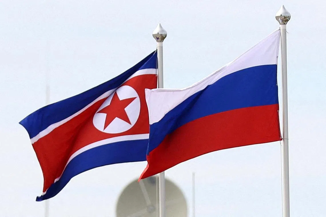 FILE PHOTO: Russian and North Korean flags fly at the Vostochny Сosmodrome, the venue of the meeting between Russia's President Vladimir Putin and North Korea's leader Kim Jong Un, in the far eastern Amur region, Russia, September 13, 2023. Sputnik/Artem Geodakyan/Pool via REUTERS ATTENTION EDITORS - THIS IMAGE WAS PROVIDED BY A THIRD PARTY./File Photo