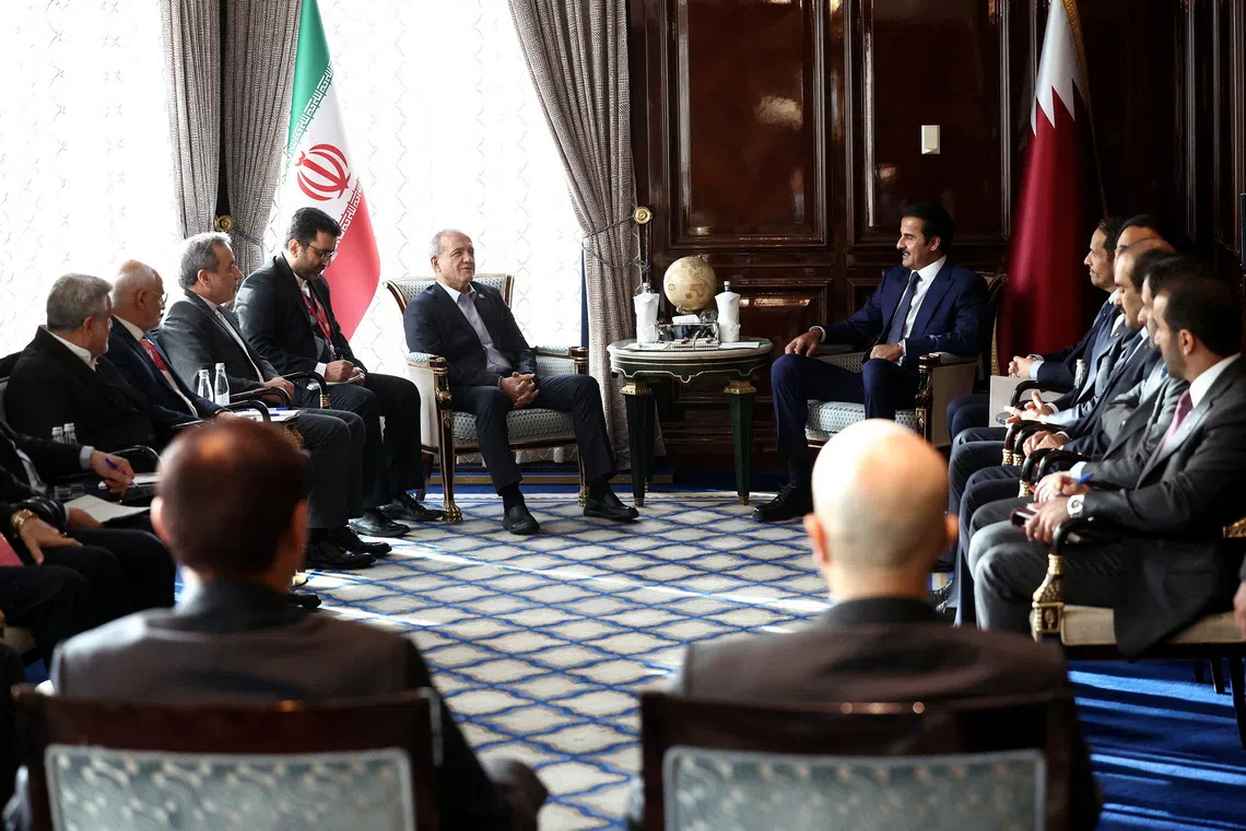 Iranian President Masoud Pezeshkian meeting Qatari Emir Sheikh Tamim bin Hamad Al Thani in Moscow, Russia, on Oct 27.