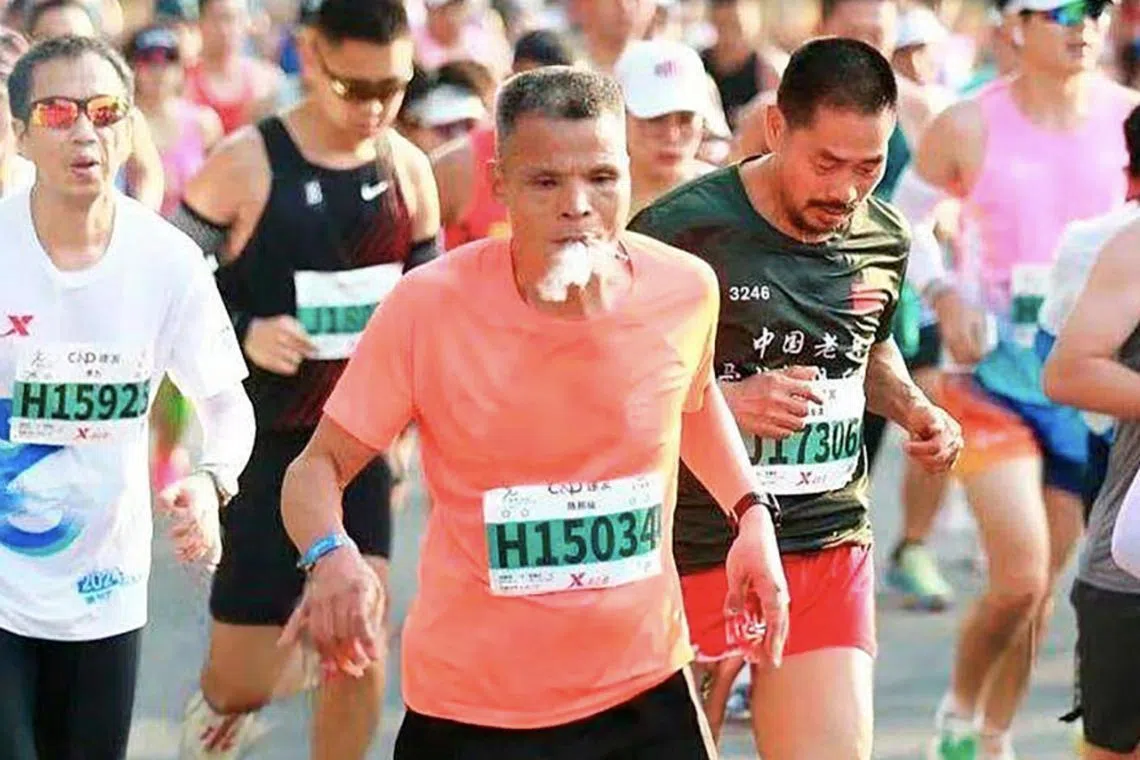 Chinese marathon runner has been disqualified from a recent event for smoking cigarette while he ran the race.