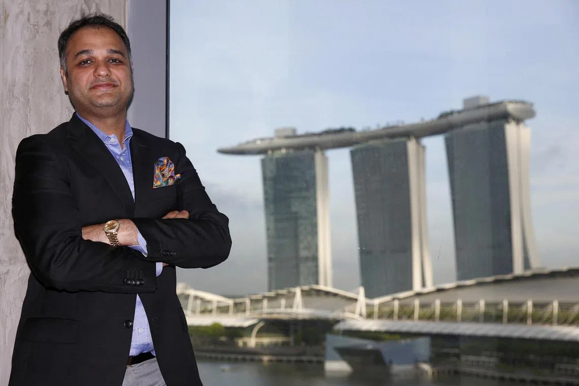 Indian businessman Prateek Gupta poses in his Singapore office on December 11, 2015. 