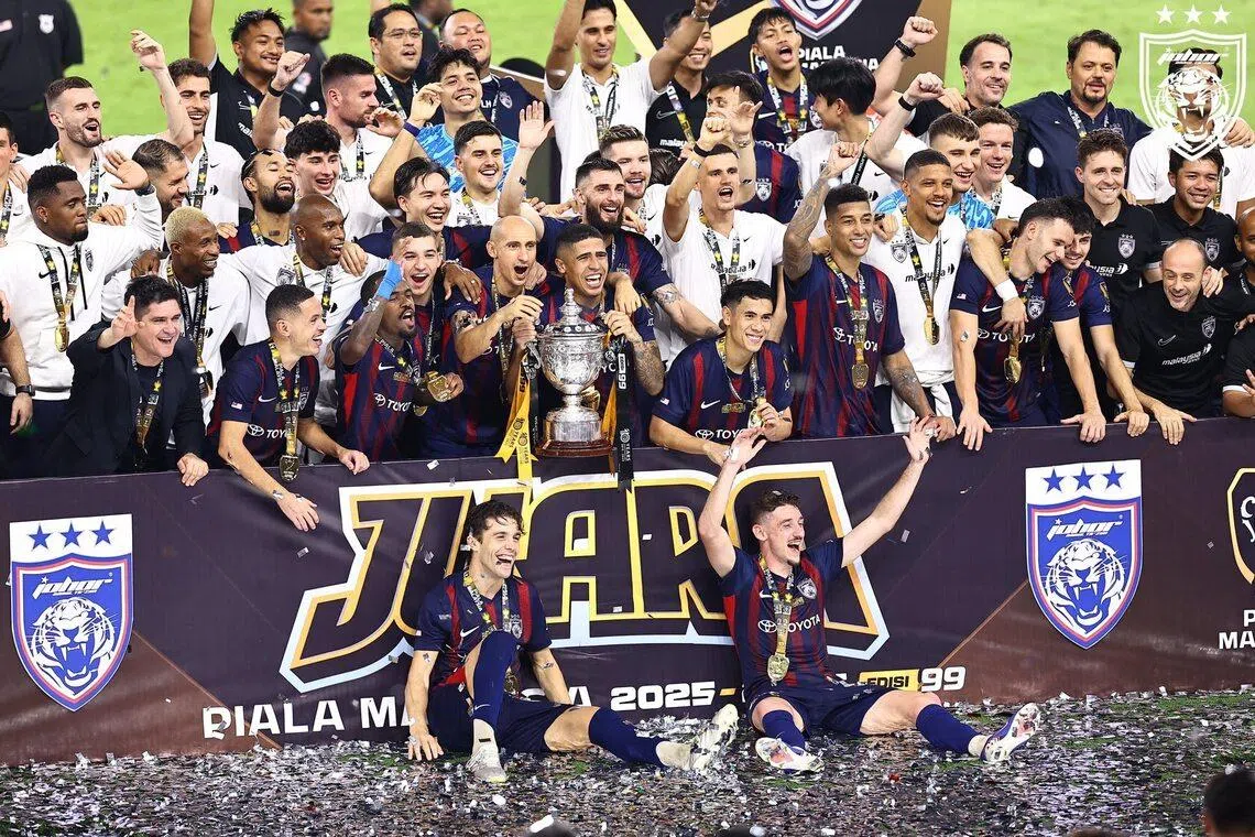 Johor Darul Takzim celebrate after defeating Kuching City 2-0 at the Bukit Jalil National Stadium to win the Malaysia Cup on May 23.