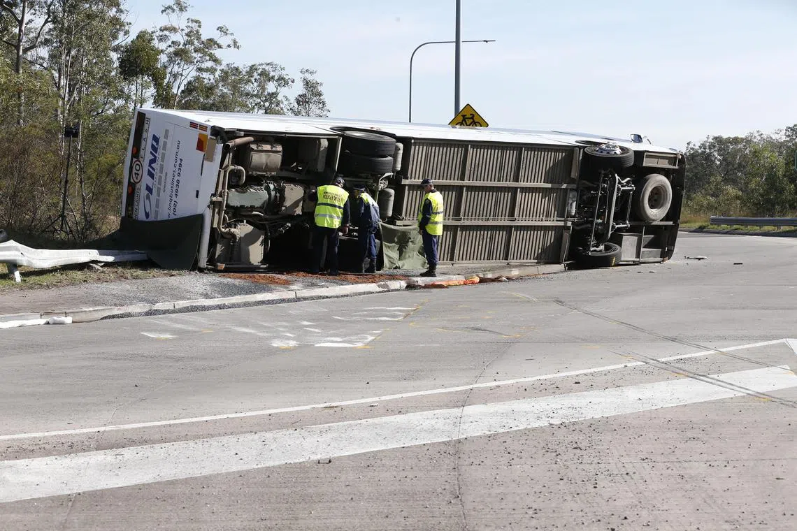 The bus was carrying 35 passengers when it lost control at a roundabout and careened onto its side, killing nine people.