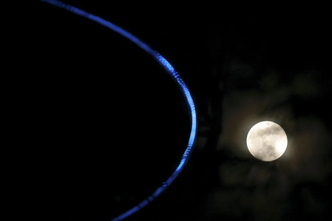 The Harvest Moon seen from Gardens by the Bay on Sept 18, 2024.