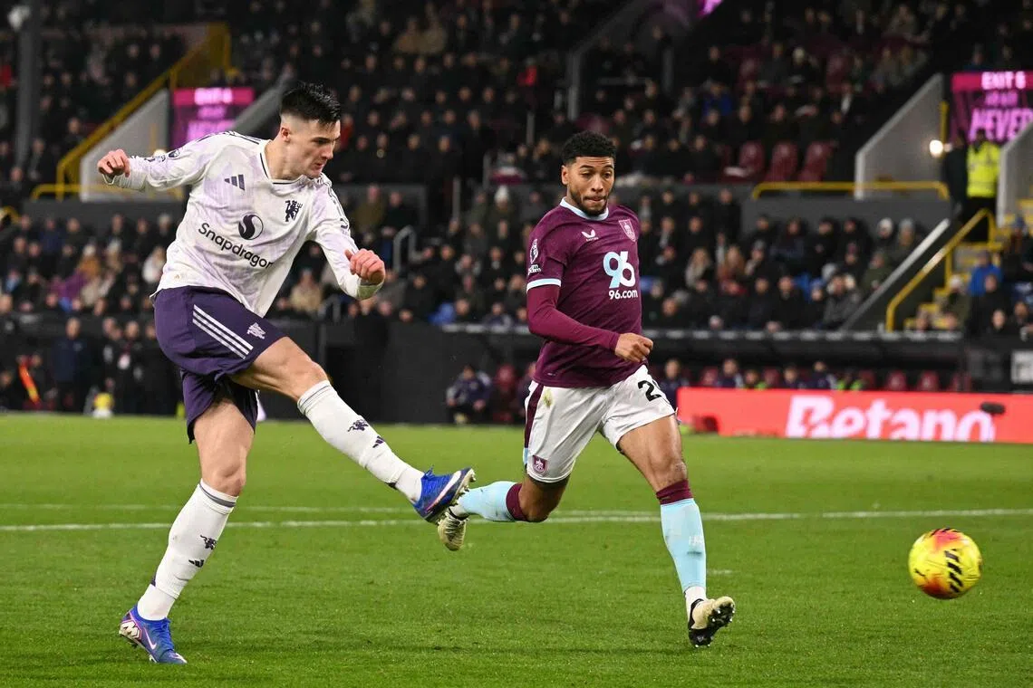 Manchester United's Slovenian striker Benjamin Sesko hammering the ball into the far corner to score the first of their two goals in a 2-2 English Premier League draw with Burnley at Turf Moor on Jan 7, 2026.
