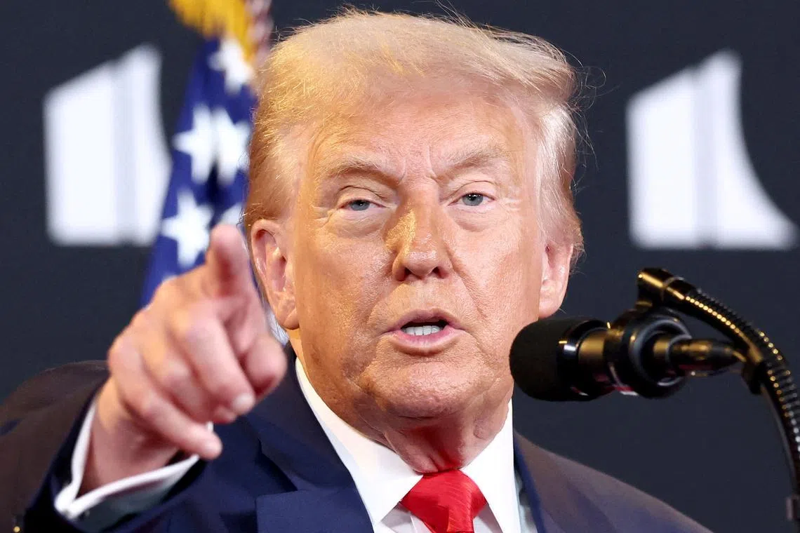 FILE PHOTO: U.S. President Donald Trump takes a question from the press during a visit to the Kennedy Center in Washington, D.C., U.S., August 13, 2025.  REUTERS/Kevin Lamarque/File Photo