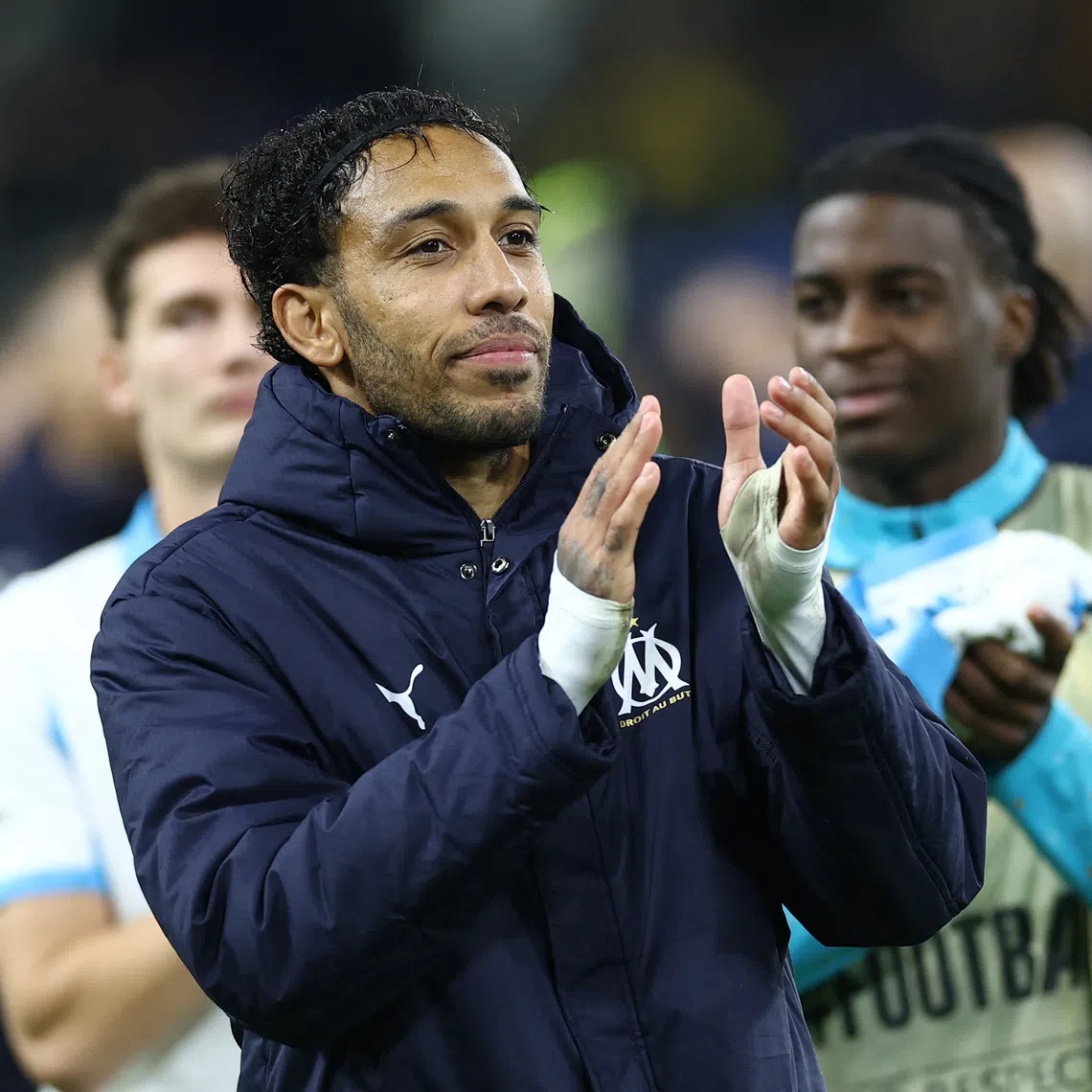 Soccer Football - UEFA Champions League - Union Saint-Gilloise v Olympique de Marseille - Stade Joseph Marien, Brussels, Belgium - December 9, 2025 Olympique de Marseille's Pierre-Emerick Aubameyang applauds fans after the match REUTERS/Yves Herman
