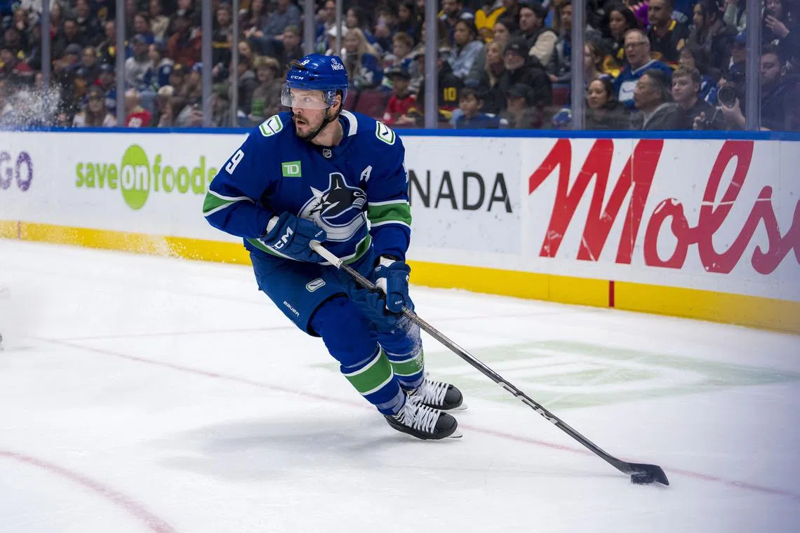 Nov 16, 2024; Vancouver, British Columbia, CAN; Vancouver Canucks forward J.T. Miller (9) handles the puck against the Chicago Blackhawks during the first period at Rogers Arena. Mandatory Credit: Bob Frid-Imagn Images/ File Photo