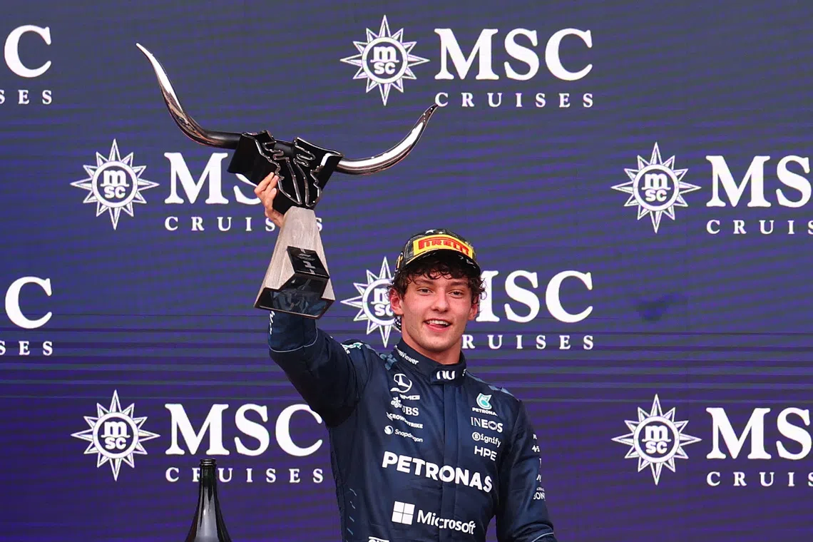 Mercedes’ Andrea Kimi Antonelli celebrates with the trophy on the podium after winning the US Grand Prix on Oct 25 in Austin, Texas.