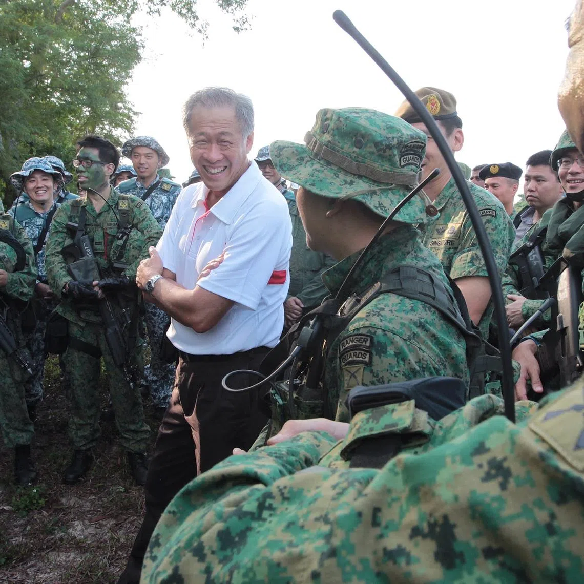 Minister for Defence Dr Ng Eng Hen (in white) visits NSmen from 702 Guards participating in Exercise Golden Sand at Pulau Sudong on April 24, 2014. Conducted from 14-28 Apr 2014, the exercise also involves support elements from the Army, the Republic of Singapore Air Force (RSAF) and the Republic of Singapore Navy (RSN).