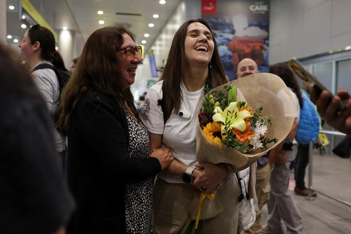 Edita Bizama laughs with her daughter Adamary Garcia, one of the victims of Pinochet-era forced adoptions, at the airport in Santiago, Chile February 22, 2025. REUTERS/Pablo Sanhueza