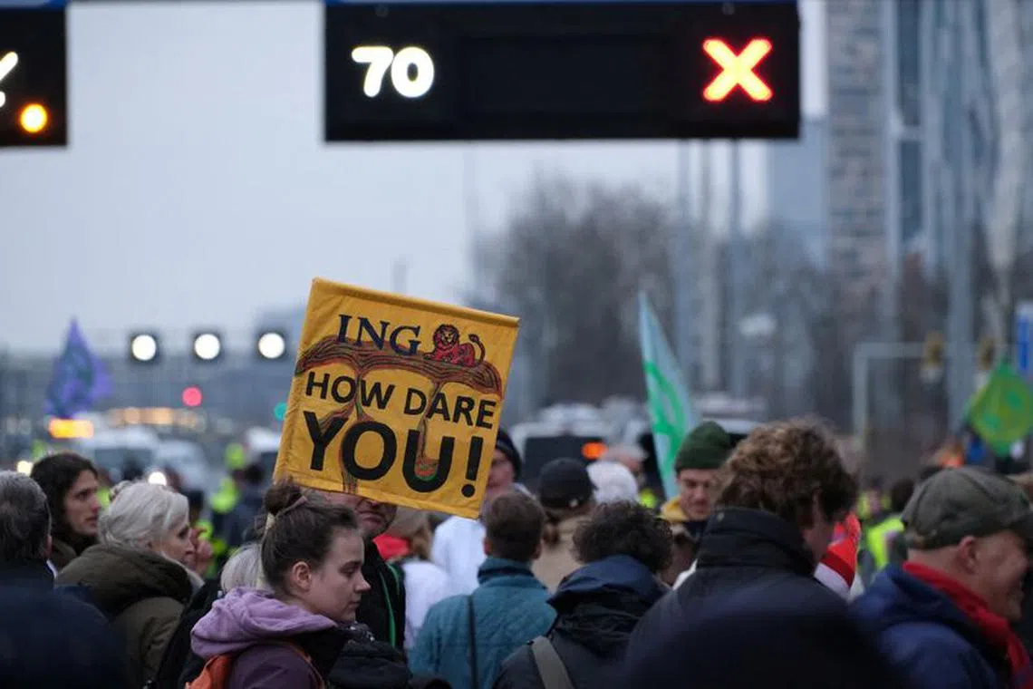 Climate activists from Extinction Rebellion Netherlands protest against ING on a highway in Amsterdam, Netherlands December 30, 2023 in this picture obtained from social media. Extinction Rebellion Netherlands/via REUTERS