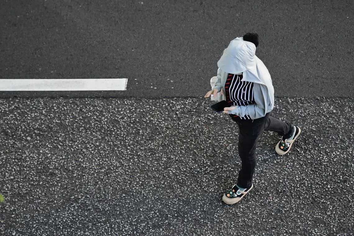 While pedestrians who used their phones while crossing the road knew it was dangerous, they said it was a hard habit to break and felt they were being careful enough.