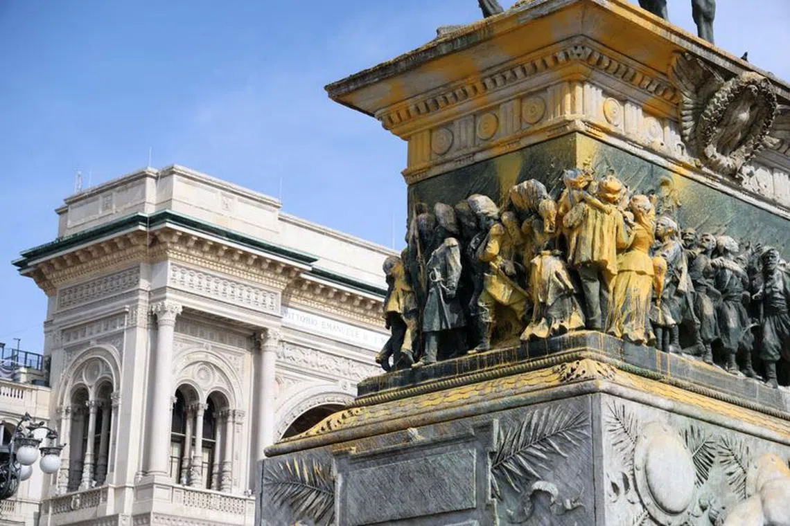 FILE PHOTO: A statue of Italy's King Vittorio Emanuele II in Piazza Duomo, which was doused with paint by \"Ultima Generazione'' (Last Generation) climate activists as part of an action against the financing of fossil fuels, is seen in Milan, Italy, March 9, 2023. REUTERS/Claudia Greco/File Photo