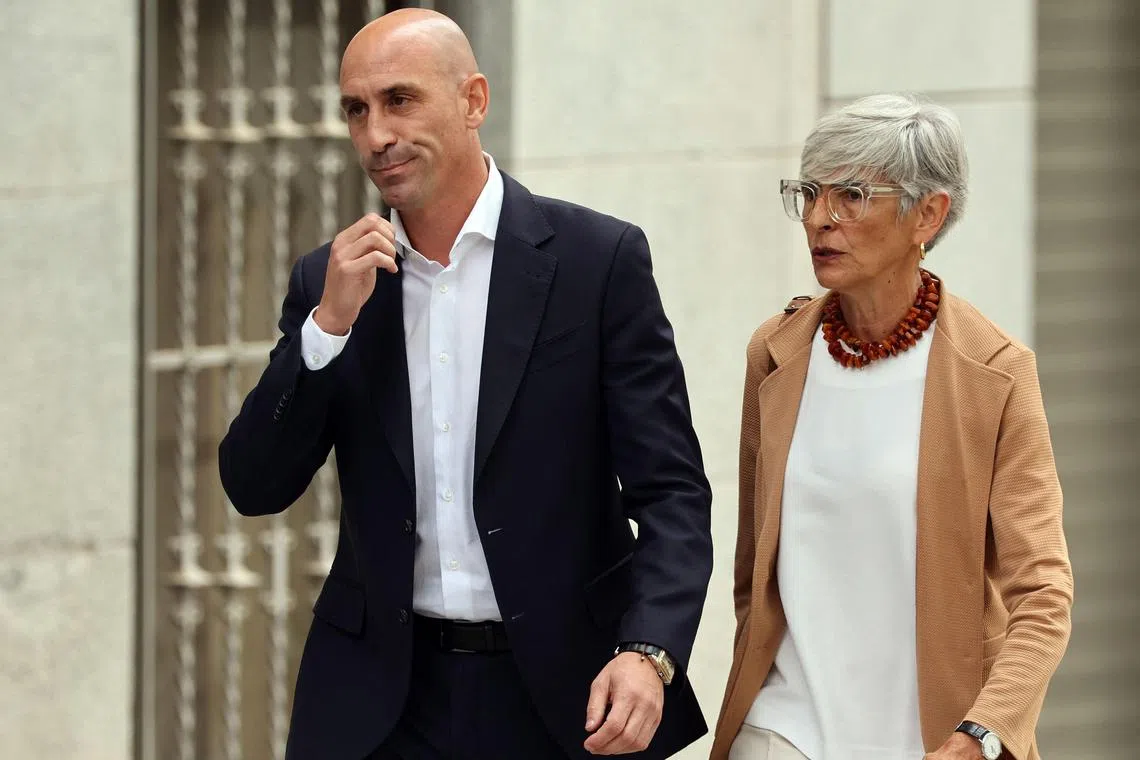 Former president of the Spanish football federation Luis Rubiales (left) and his lawyer Olga Tubau, leave the Audiencia Nacional court in Madrid on Friday.
