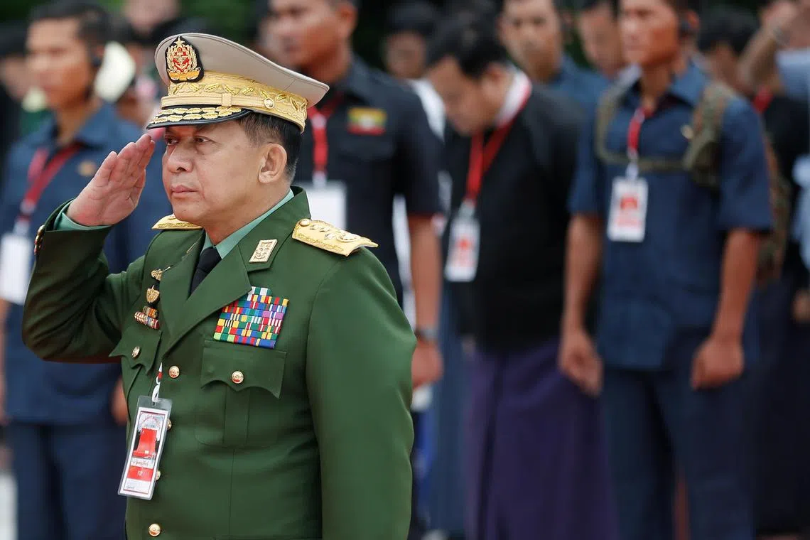 FILE PHOTO: Myanmar's Commander in Chief Senior General Min Aung Hlaing salutes as he attends an event marking Martyrs' Day at Martyrs' Mausoleum in Yangon, Myanmar July 19, 2018. REUTERS/Ann Wang/File Photo