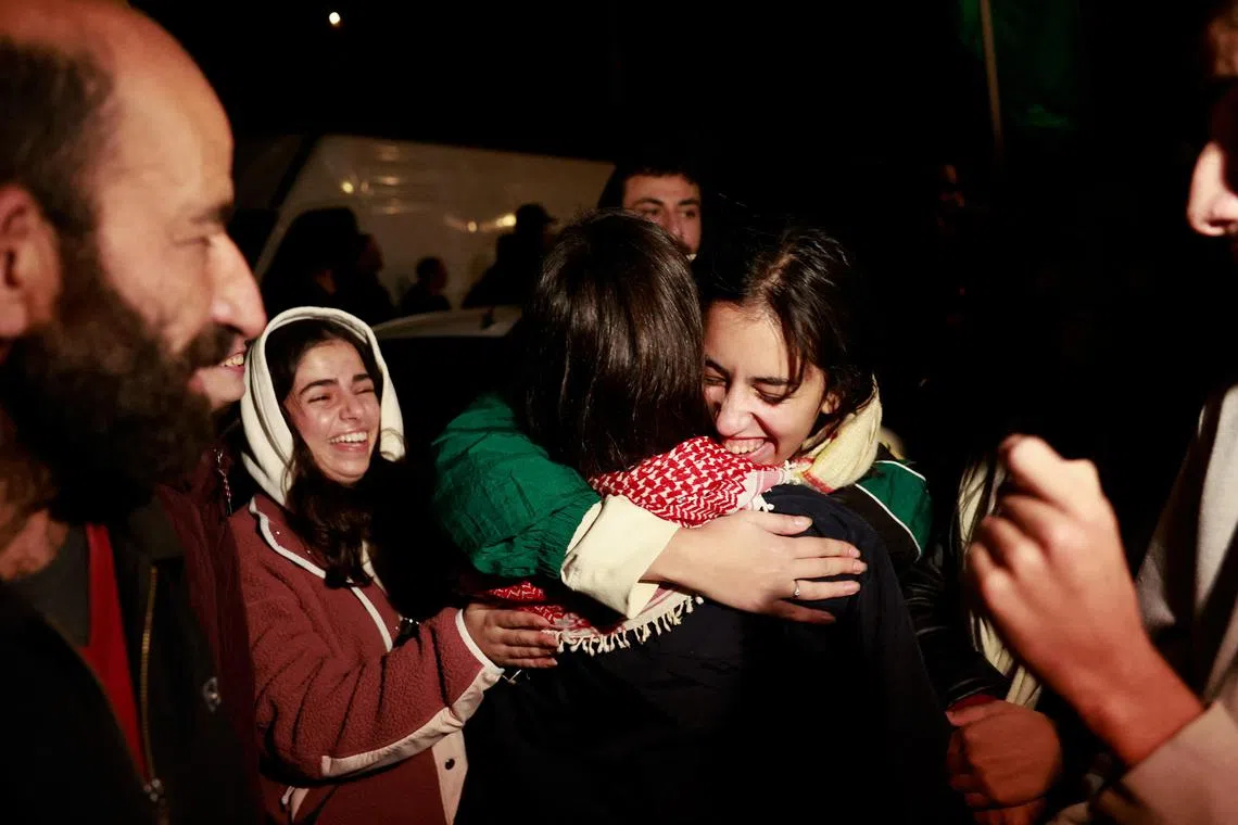 People react after the release of Palestinian prisoners amid a hostages-prisoners swap deal between Hamas and Israel, in Ramallah in the Israeli-occupied West Bank, November 28, 2023. REUTERS/Ammar Awad