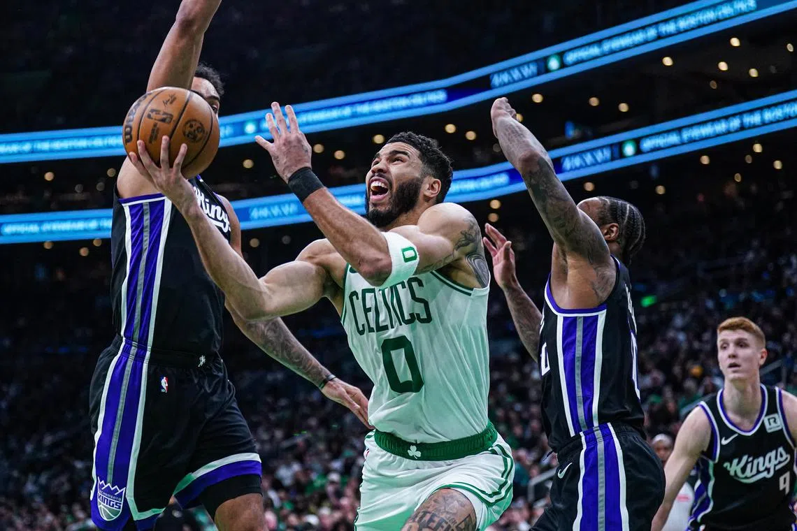 Boston Celtics forward Jayson Tatum shoots the ball against the Sacramento Kings in the second half at TD Garden.