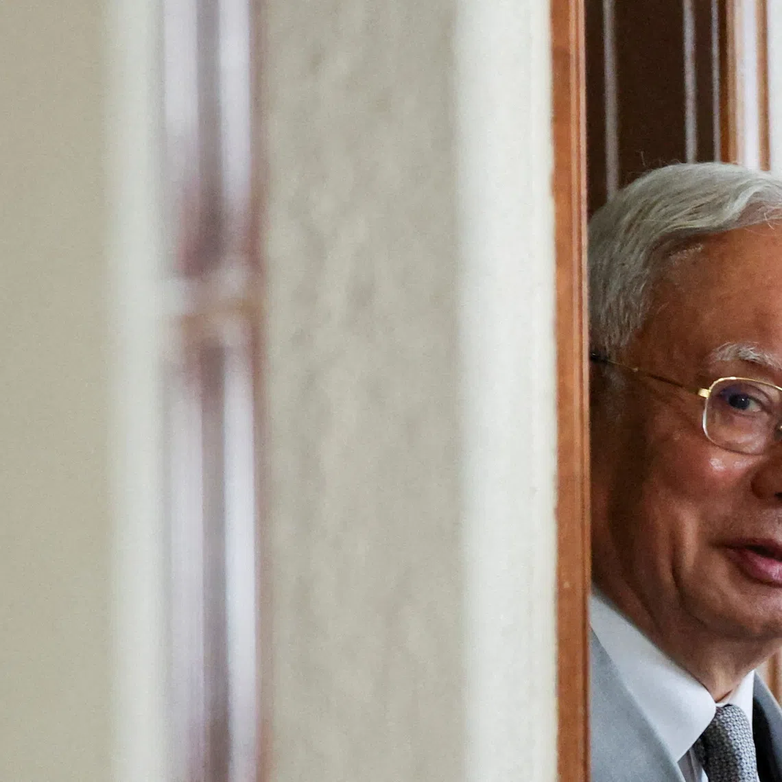 FILE PHOTO: Malaysia's former Prime Minister Najib Razak, jailed for corruption in the multibillion-dollar 1MDB scandal, attends the verdict of his house arrest bid at Kuala Lumpur Courts Complex in Kuala Lumpur, Malaysia December 22, 2025. REUTERS/ Hasnoor Hussain/File Photo