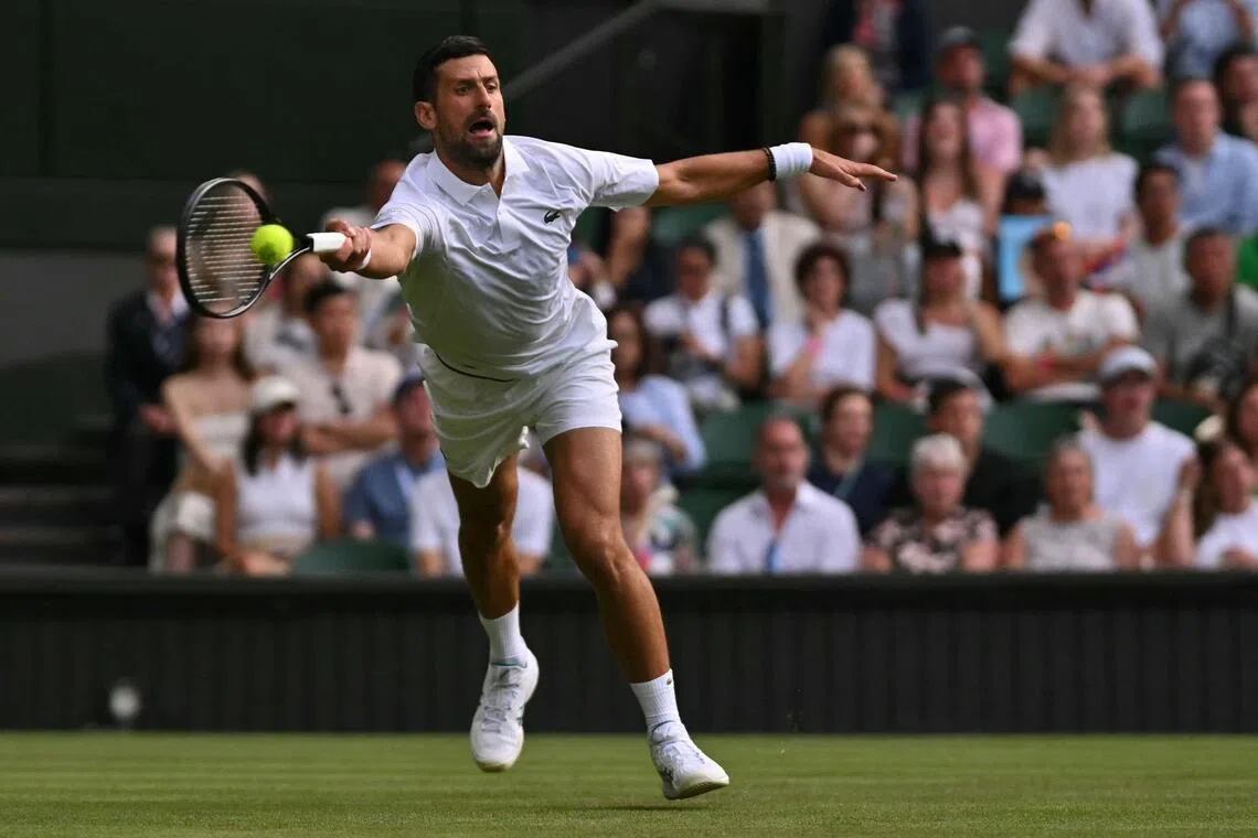 Serbia’s Novak Djokovic returns the ball to China’s Yibing Wu during their men’s singles first round match on the first day of the 2026 Wimbledon Championships.