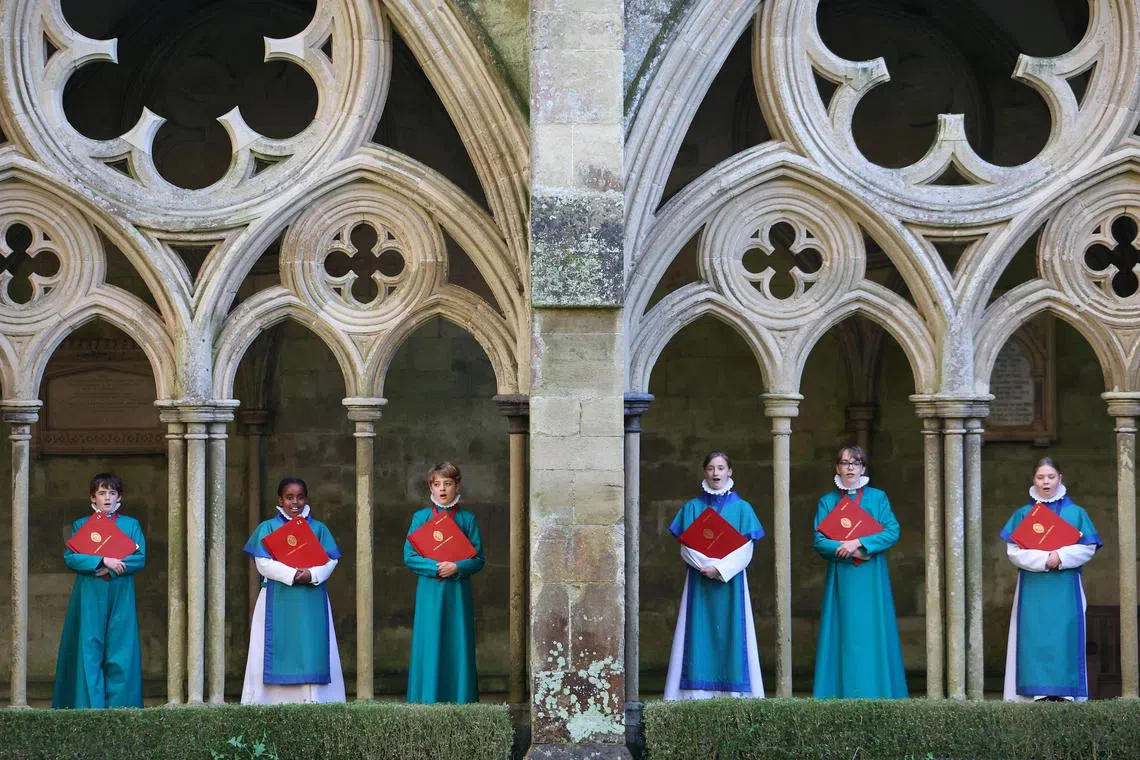 Salisbury Cathedral choristers pose in the cloisters as they prepare to rehearse for festive season performances at Salisbury Cathedral, Salisbury, Britain, December 21, 2024. REUTERS/Toby Melville     TPX IMAGES OF THE DAY     