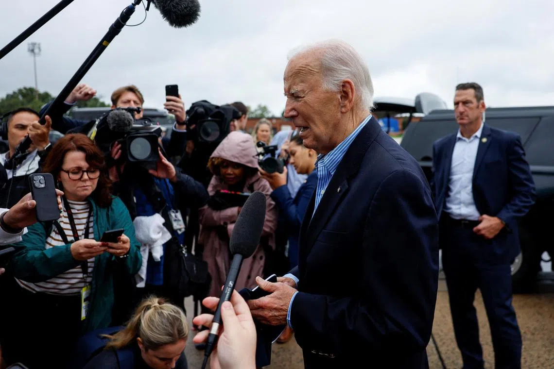 US President Joe Biden speaking to members of the media on Oct 2, before boarding Air Force One en route to North and South Carolina, in the wake of Hurricane Helene.