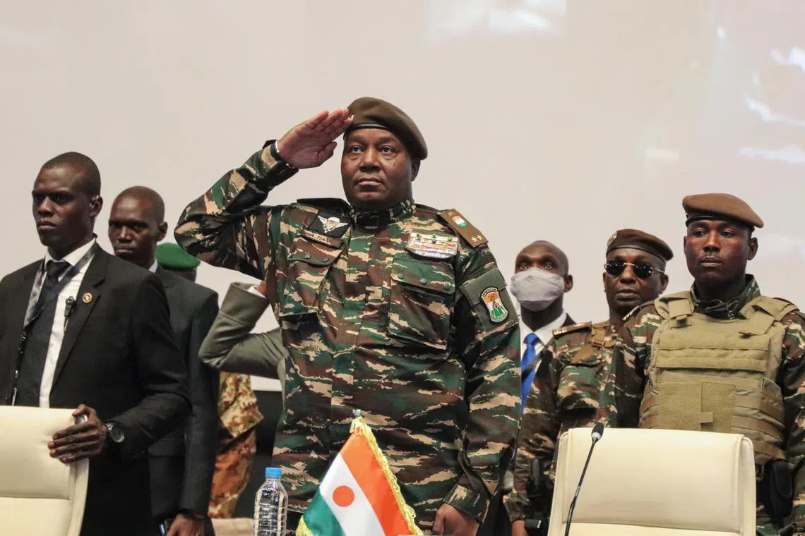 Head of the military junta in Niger, General Abdourahamane Tchiani, saluting at a Sahel states summit in the country's capital, Niamey, on July 6.
