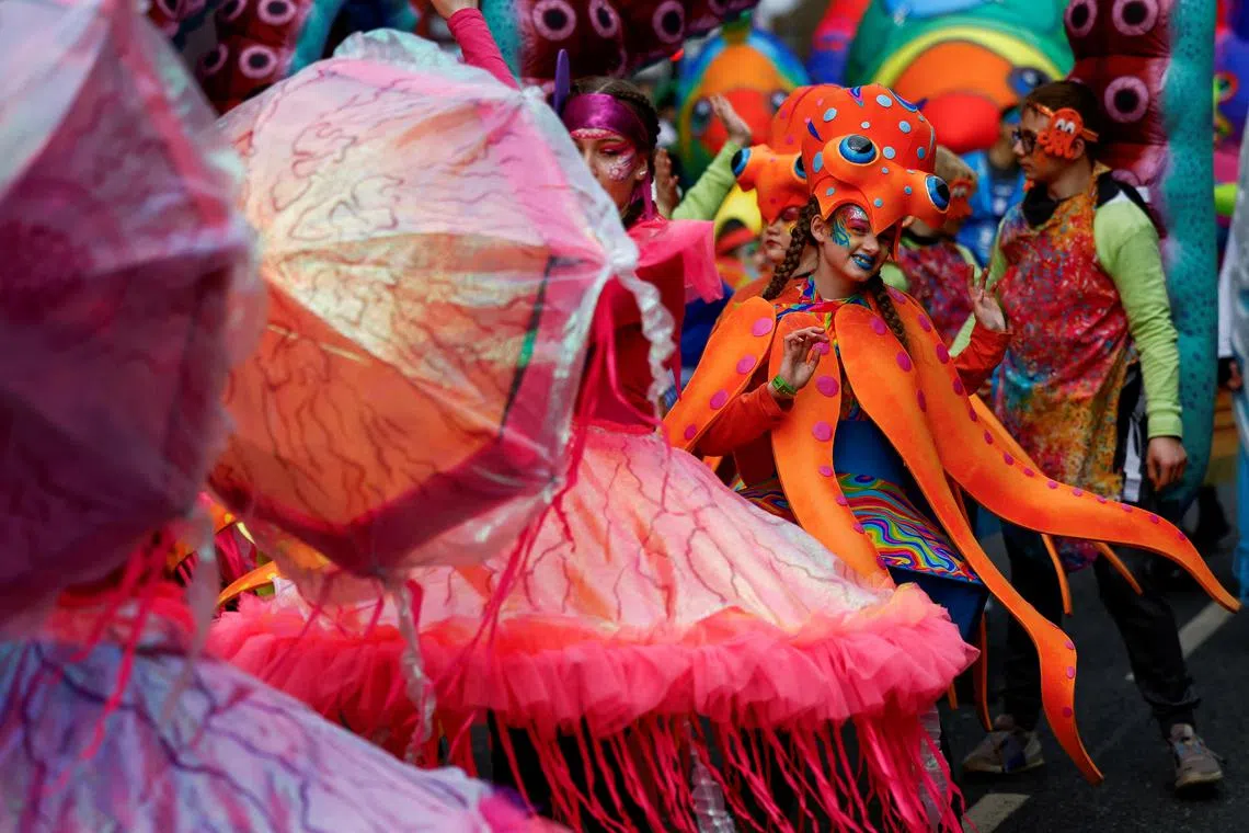 A participant smiling  during the St. Patrick's Day parade in Dublin, Ireland March 17, 2024. 
