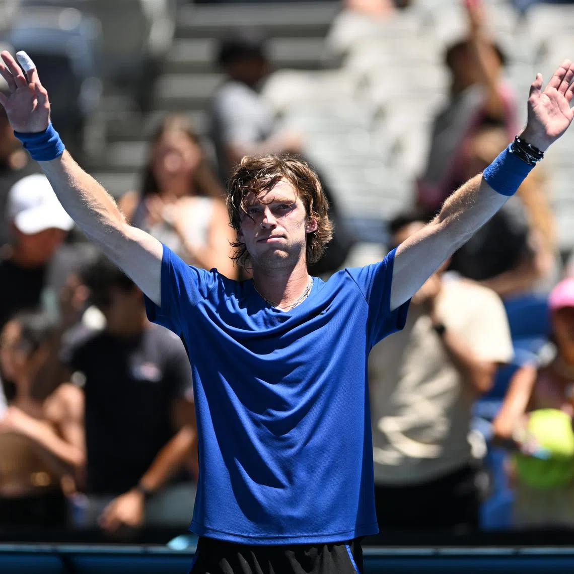 Andrey Rublev celebrates after defeating Dominic Thiem of Austria during their fist round match at the 2023 Australian Open on Jan 17.