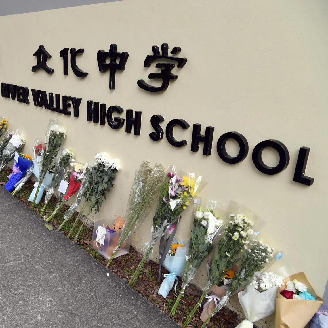 Well-wishers left bouquets of flowers, cards, candles and soft toys for a 13-year-old River Valley High School student who was killed on campus by a 16-year-old schoolmate on July 19, 2021. Photos taken on July 20, 2021.
