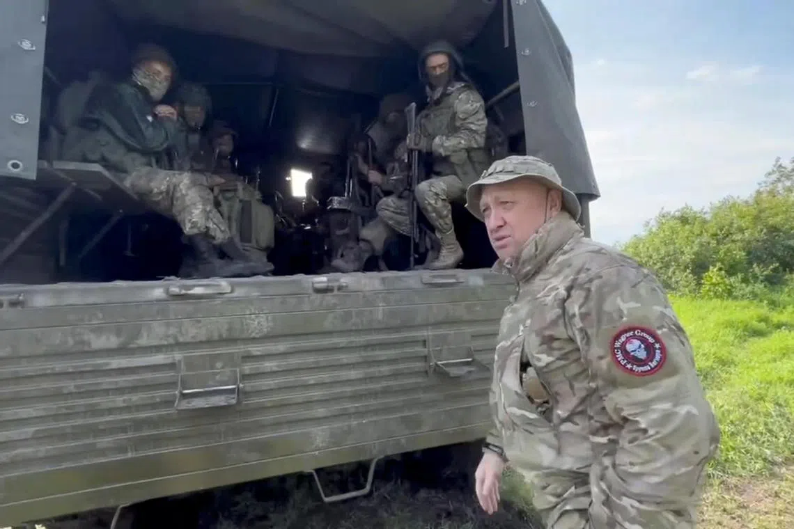 Mr Prigozhin speaks with servicemen during withdrawal of his forces from Bakhmut and handing over their positions to regular Russian troops, in the course of Russia-Ukraine conflict in an unidentified location.
