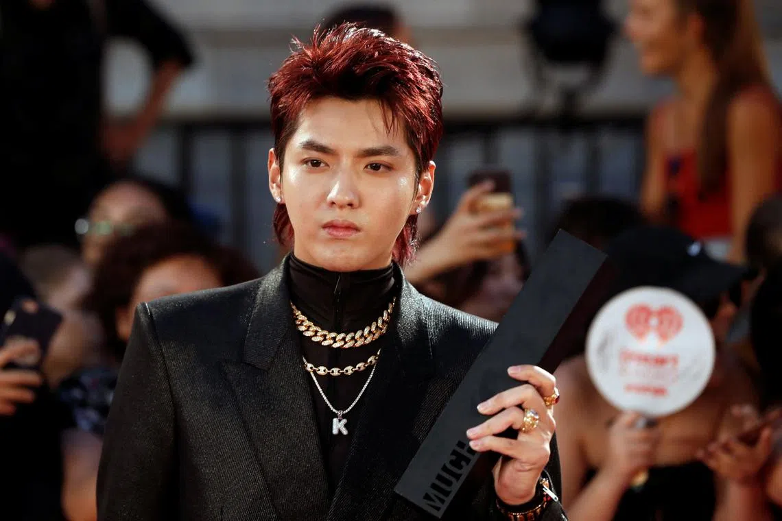 Singer-actor Kris Wu, seen here in a 2018 file photo, has been sentenced to 13 years for rape and gathering people to commit adultery.